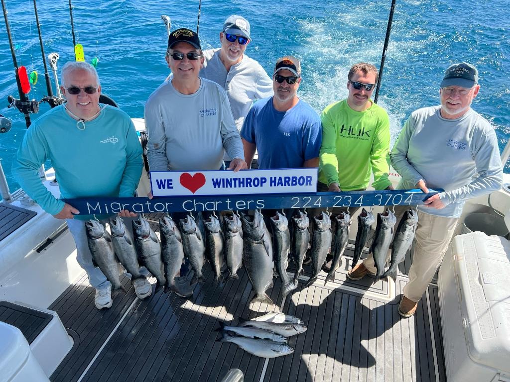 Migrator Charters fishing group with Lake Michigan salmon catch, Winthrop Harbor